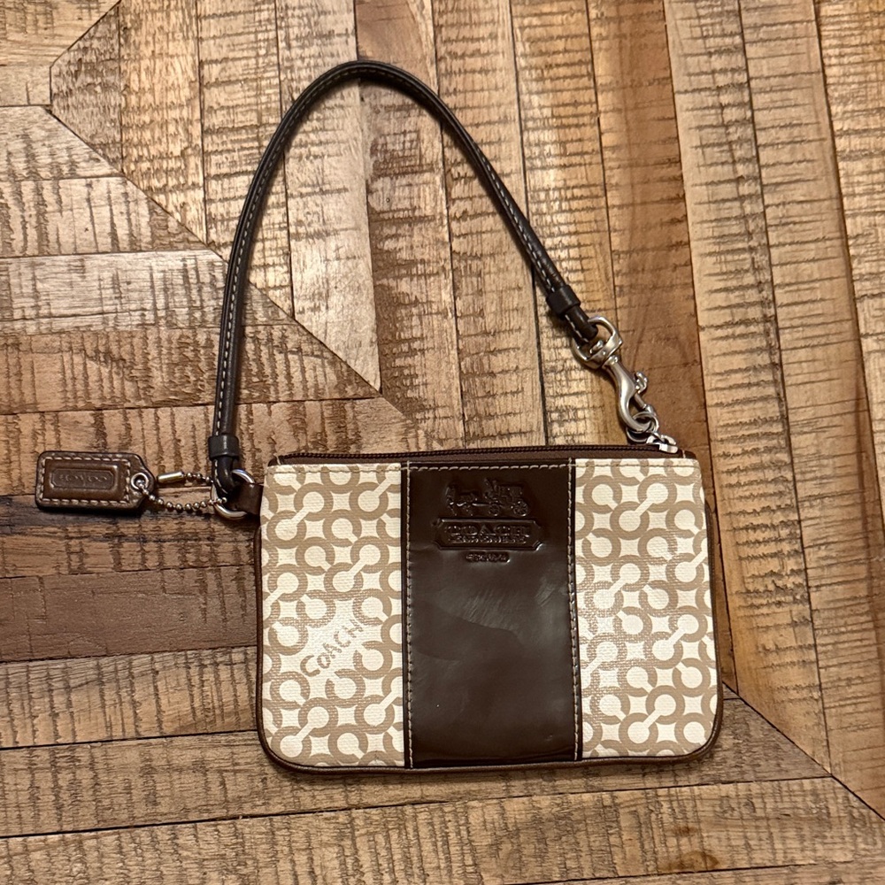 Sleek coach wristlet